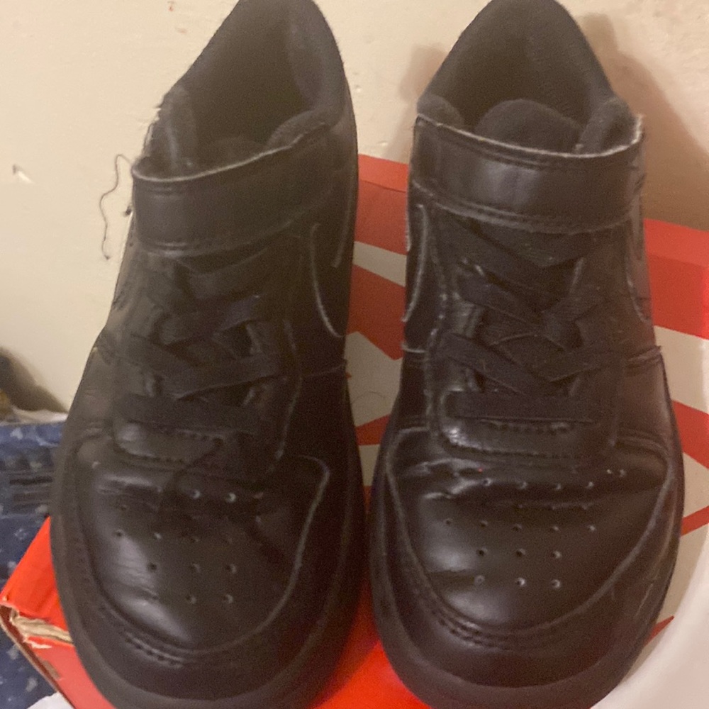 A black Boys pair of Nike Air Force
